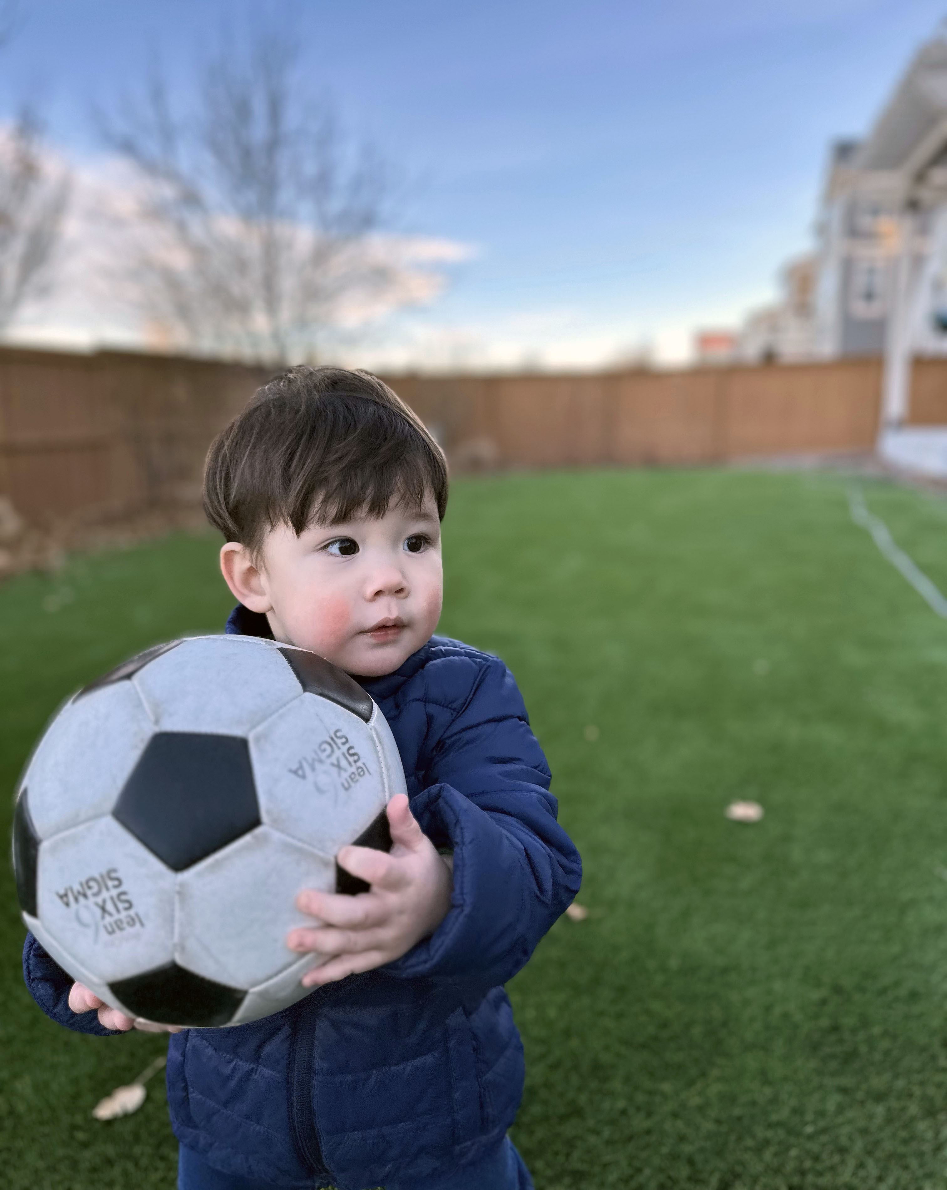 2024 @ Parker, CO, Playing soccer with big brother Nikolaos in the backyard